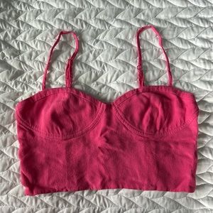A cute pink top from Aritzia that was worn once! Size small and true to size.